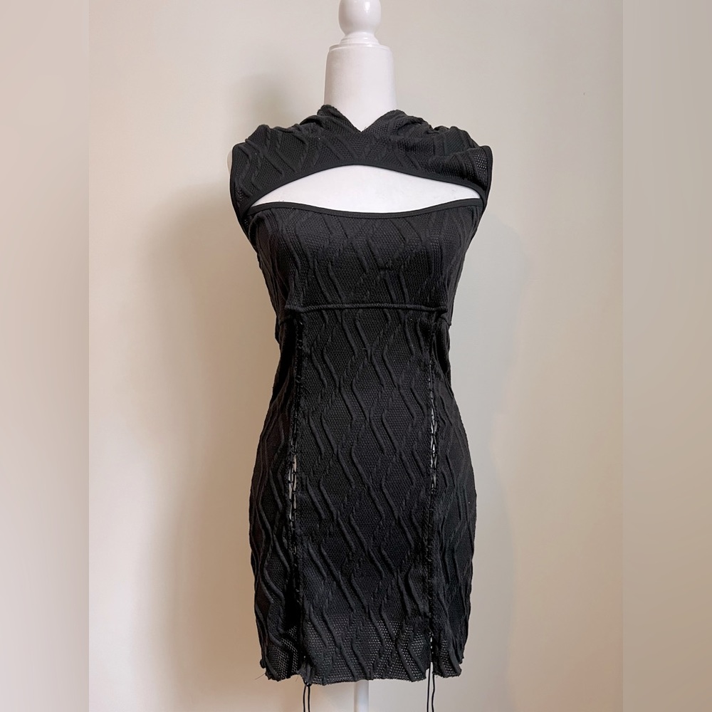 Hooded black mini dress with cutout and front lace up detail